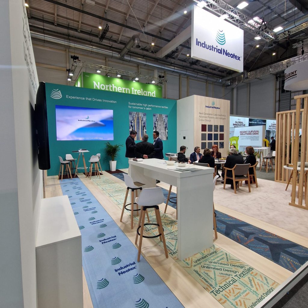 Neotex stand at AIX Hamburg 2026 featuring the NeoDye® area and textile solutions for aircraft interiors.