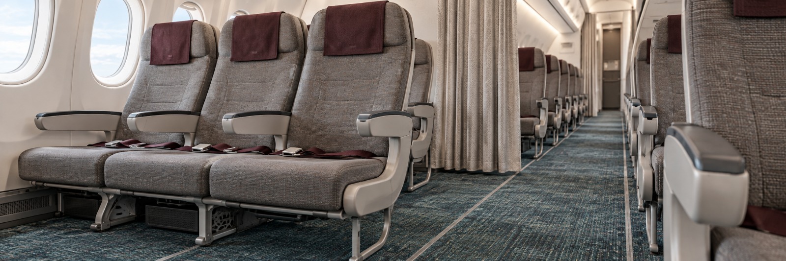 Cabina de avión comercial con moqueta aeronáutica y asientos tapizados de Industrial Neotex